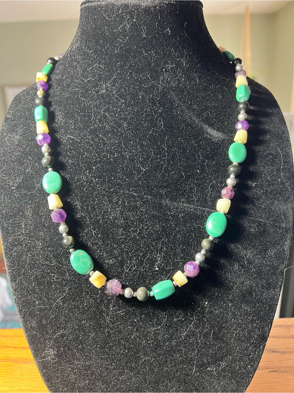 Multi-gemstone necklace in purple, blue , white and sterling. Hook closure.